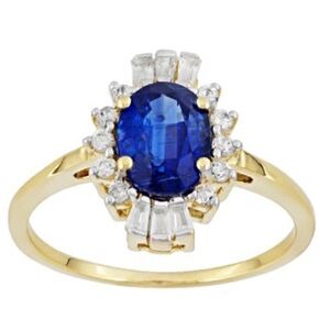 1.60CT OVAL KYANITE WITH.33CTW TAPERED BAGUETTE AND ROUND WHITE ZIRCON 10K YELLO